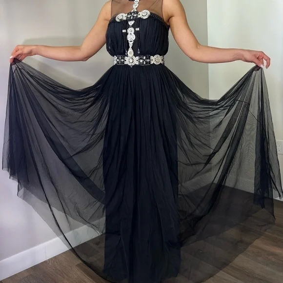 Naeem Khan gown embellished with allover embroidery Round neckline; open back